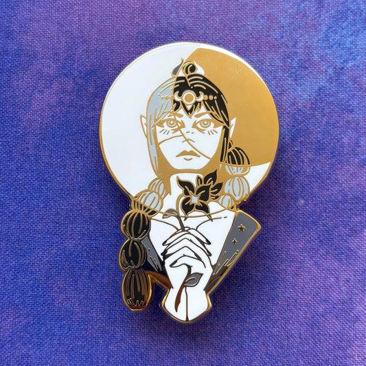 Gold and white enamel Shadowheart pin featuring an elf-like figure with celestial accents.