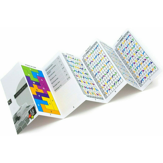 Katamino Pocket, an accordion-folded booklet with colorful charts and diagrams, open on a white surface.