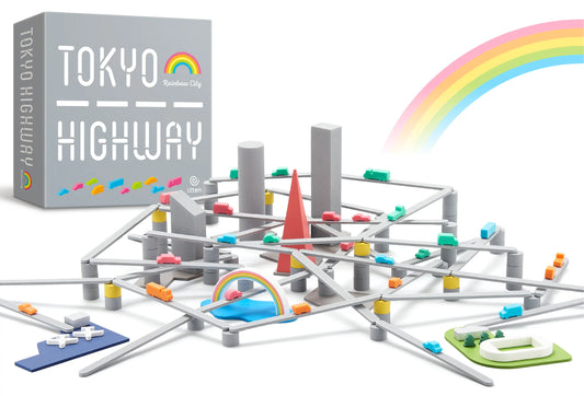Tokyo Highway RAINBOW CITY board game set with elevated roads, cars, buildings, and a rainbow beside the box.